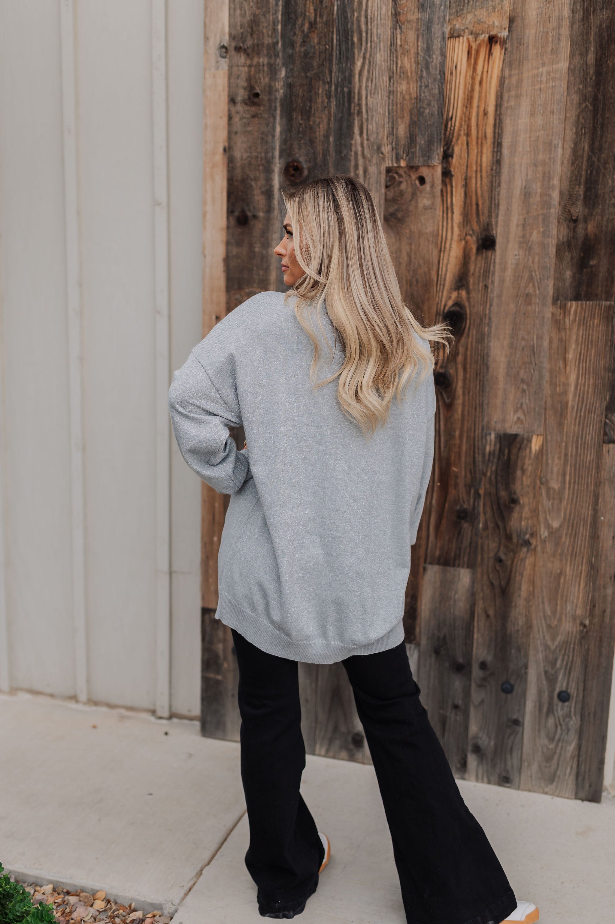 Rear view of Classic Crewneck in silver metallic with dropped shoulders and oversized length.