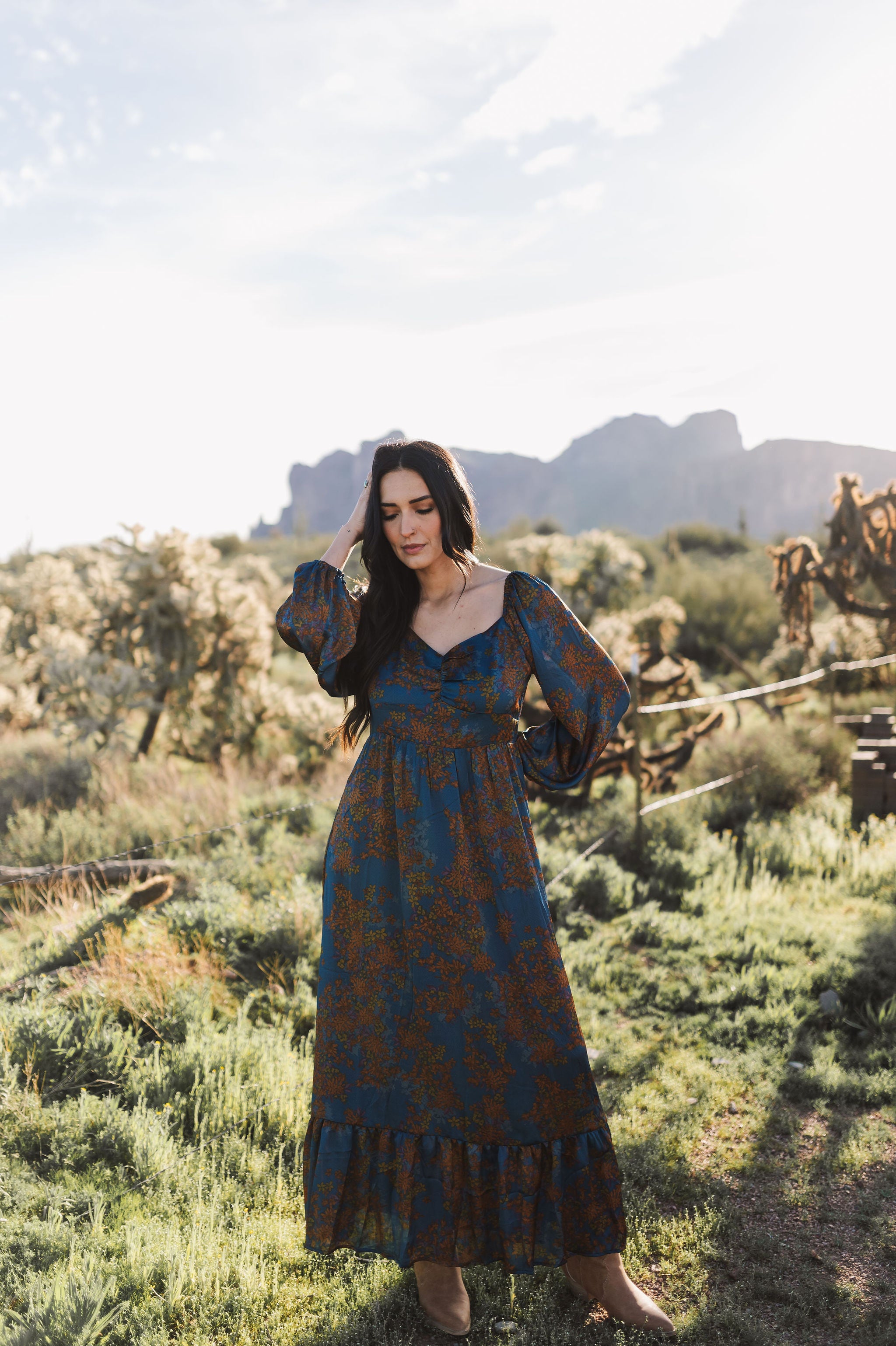 Front view of Sweetheart Long Sleeve Maxi Dress with floral design, sweetheart neckline, and ruffled hem.