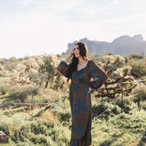 Front angled view of Sweetheart Long Sleeve Maxi Dress with floral design, sweetheart neckline, and ruffled hem.