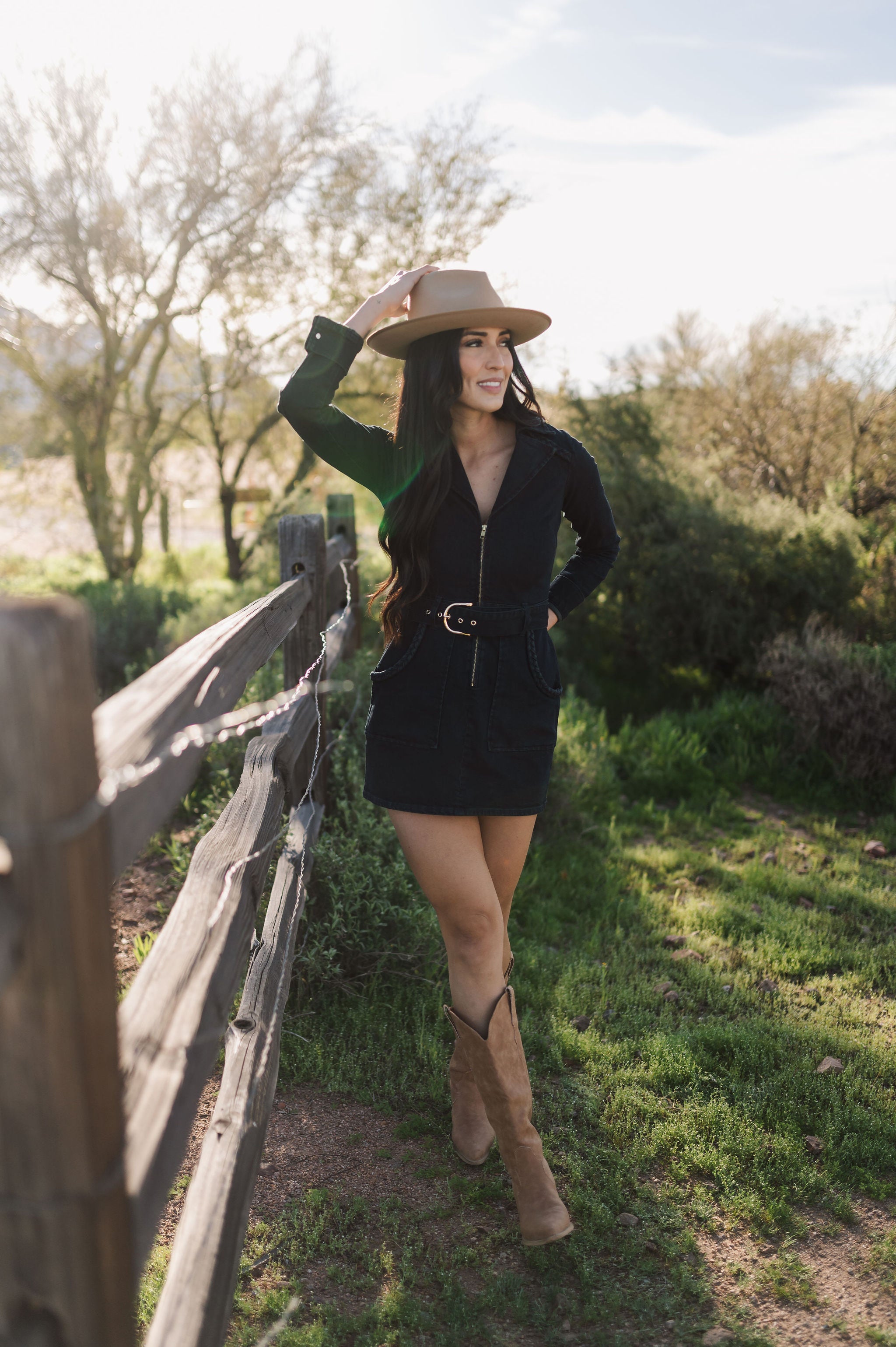 Front view of Outlaw Long Sleeve Dress in dark denim with zippered closure, belt, large pockets, and collared neck.