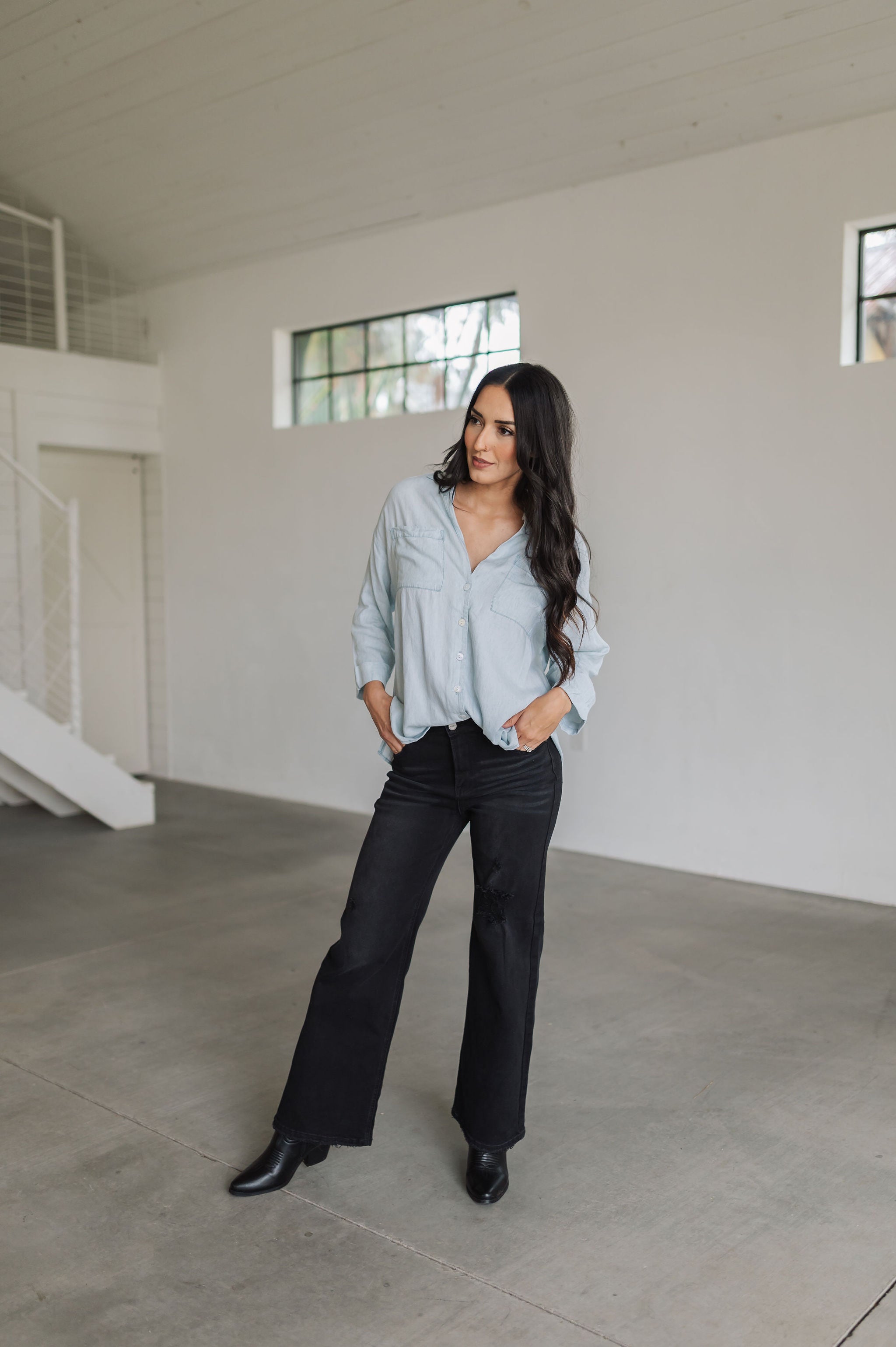 Front view of Liberty Wide Leg Jean with whisker wash and heavy distressing on leg. 