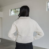 Rear view of Half Zip Pullover in bone with funnel neck and stitch detail.