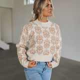 Front view of Magnolia Knit Sweater with ribbed mock neck, hem, and cuffs, and allover floral pattern. 