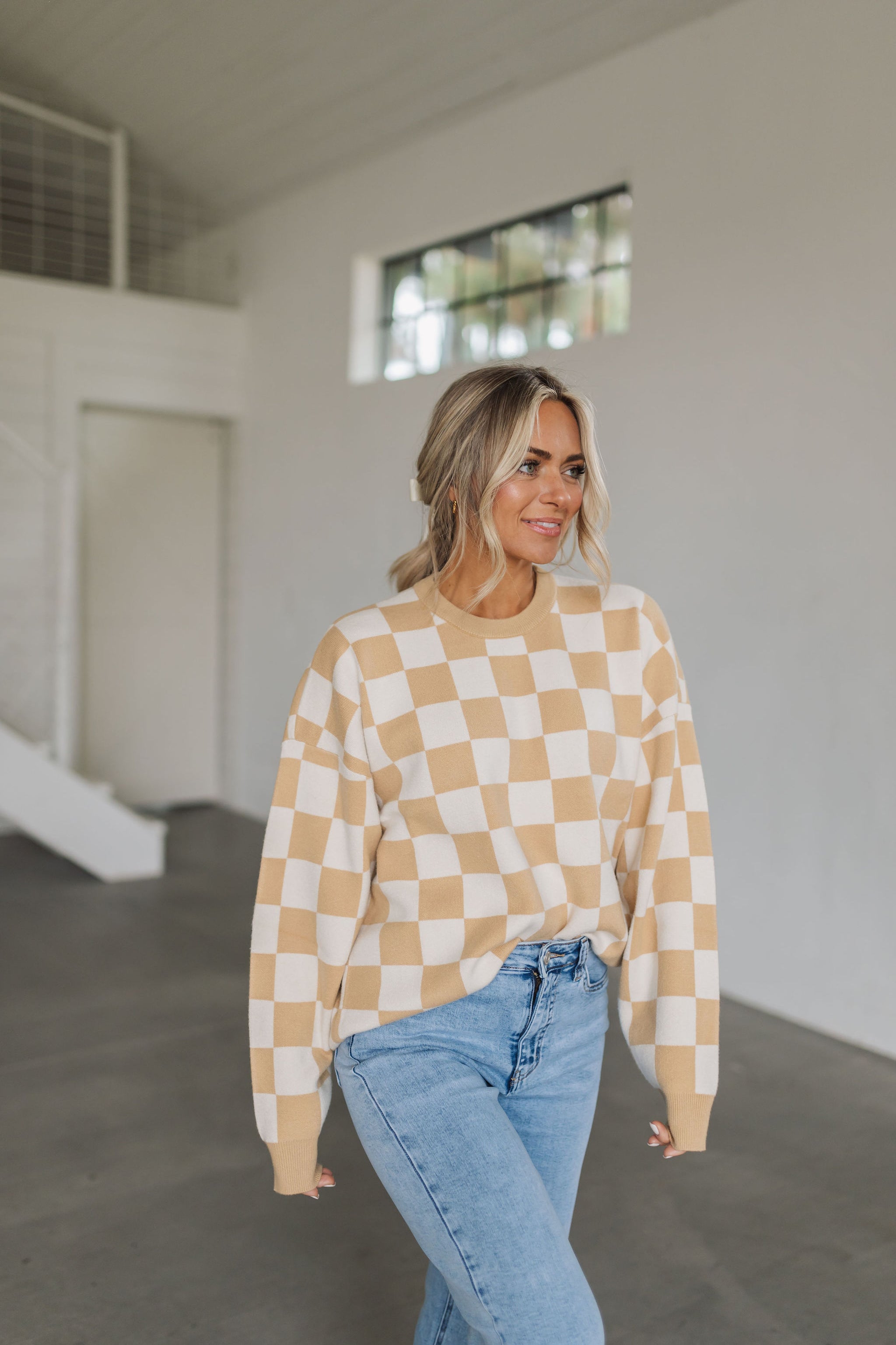 Front view of crewneck Scout Sweater in tan checker print with ribbed neck and cuffs. 