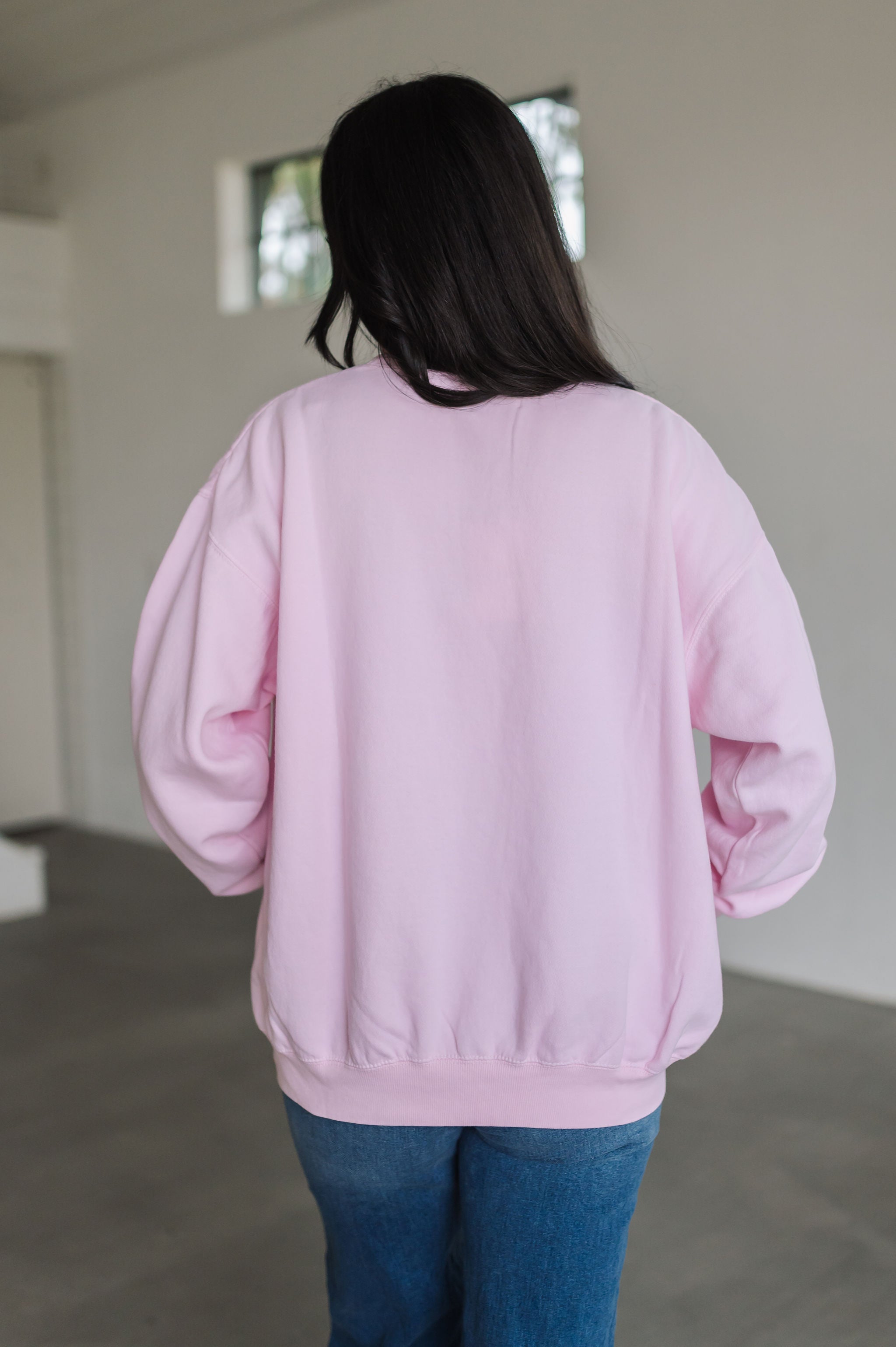 Rear view of oversized Stanley Sweatshirt.