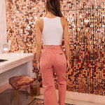 Rear view of rose colored Sailor Scoop wide leg ankle jeans.  
