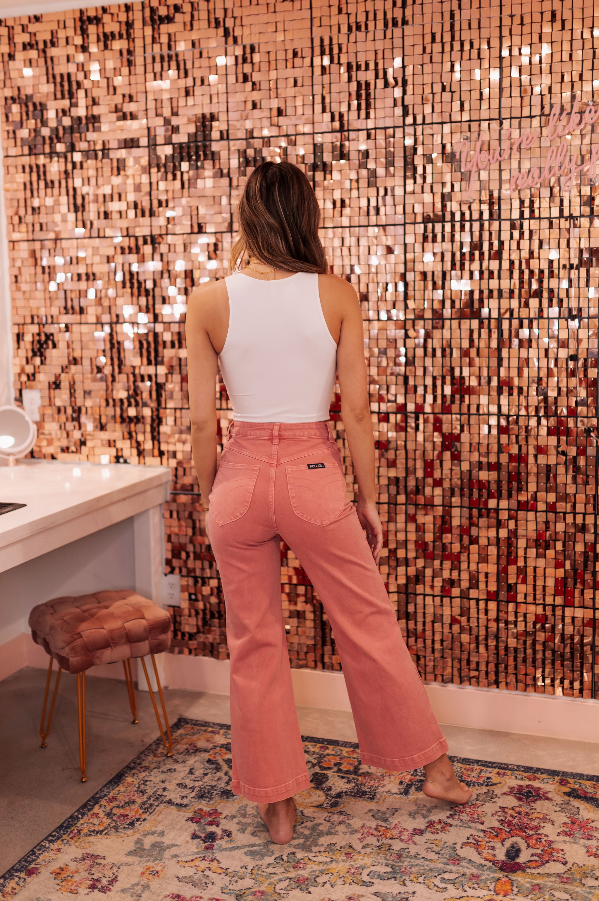 Rear view of rose colored Sailor Scoop wide leg ankle jeans.  