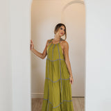 Front view of Palm Skies Tiered Maxi Dress in green with tiered and blocking details and self tie shoulder straps. 