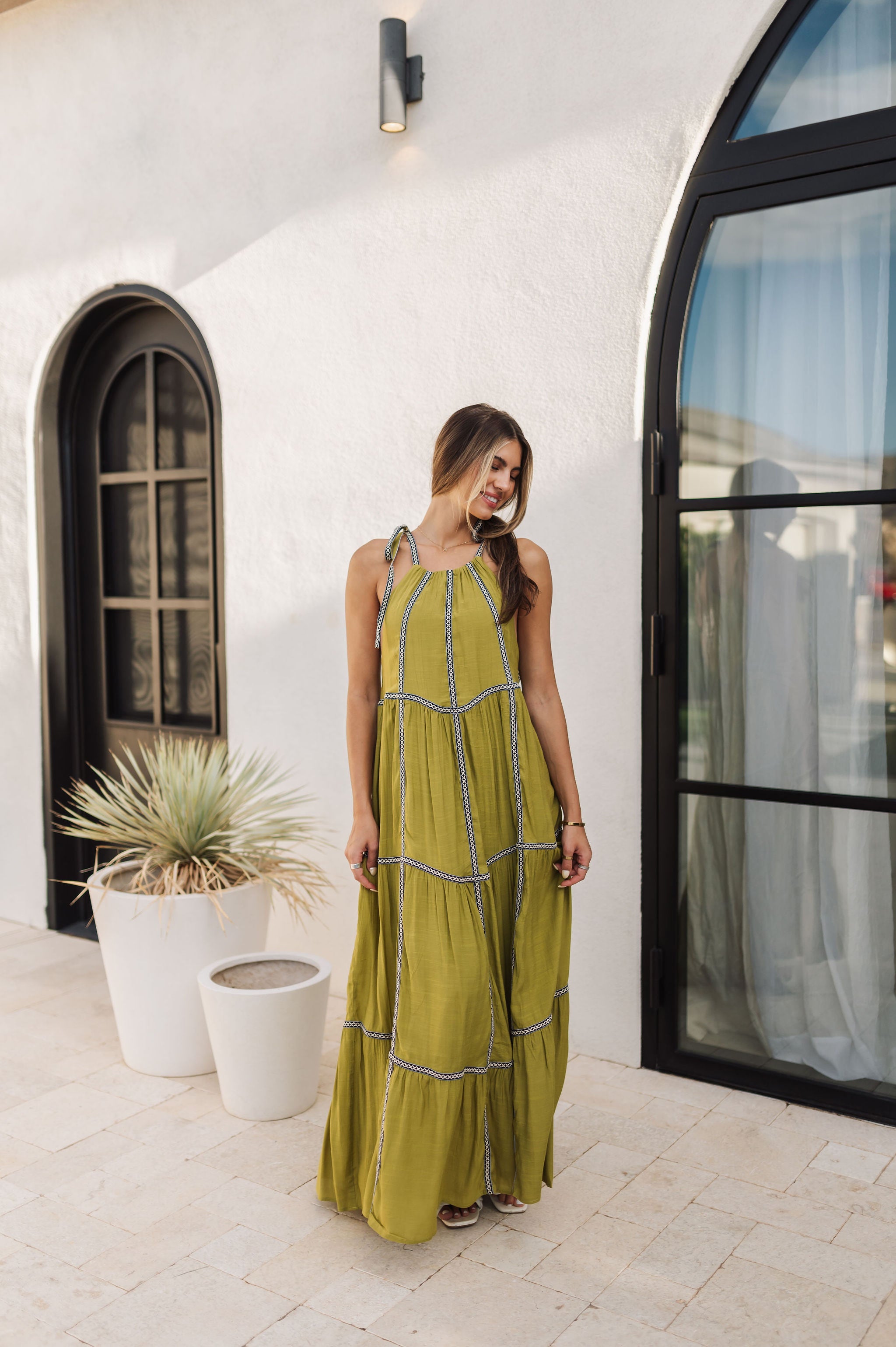 Front view of Palm Skies Tiered Maxi Dress in green with tiered and blocking details and self tie shoulder straps. 