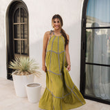 Front view of Palm Skies Tiered Maxi Dress in green with tiered and blocking details and self tie shoulder straps. 