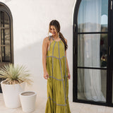 Front view of Palm Skies Tiered Maxi Dress in green with tiered and blocking details and self tie shoulder straps. 