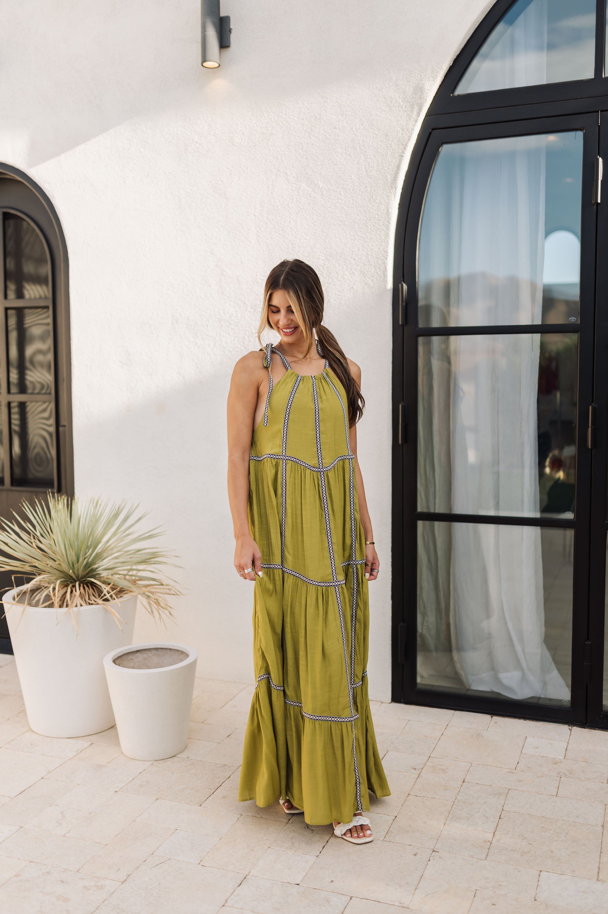 Front view of Palm Skies Tiered Maxi Dress in green with tiered and blocking details and self tie shoulder straps. 