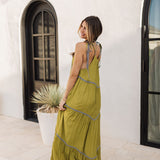 Rear view of Palm Skies Tiered Maxi Dress in green with tiered and blocking details and self tie shoulder straps. 