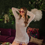 Front view of white crochet Castaway Tunic with fringe hem.