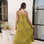 Rear view of Palm Skies Tiered Maxi Dress in green with tiered and blocking details and self tie shoulder straps. 