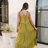 Rear view of Palm Skies Tiered Maxi Dress in green with tiered and blocking details and self tie shoulder straps. 