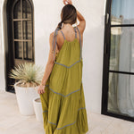 Rear view of Palm Skies Tiered Maxi Dress in green with tiered and blocking details and self tie shoulder straps. 