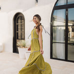 Side view of Palm Skies Tiered Maxi Dress in green with tiered and blocking details and self tie shoulder straps. 