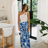 Front view of Coastal Breeze Pants in blue and white tropical print with wide legs and front tie. 