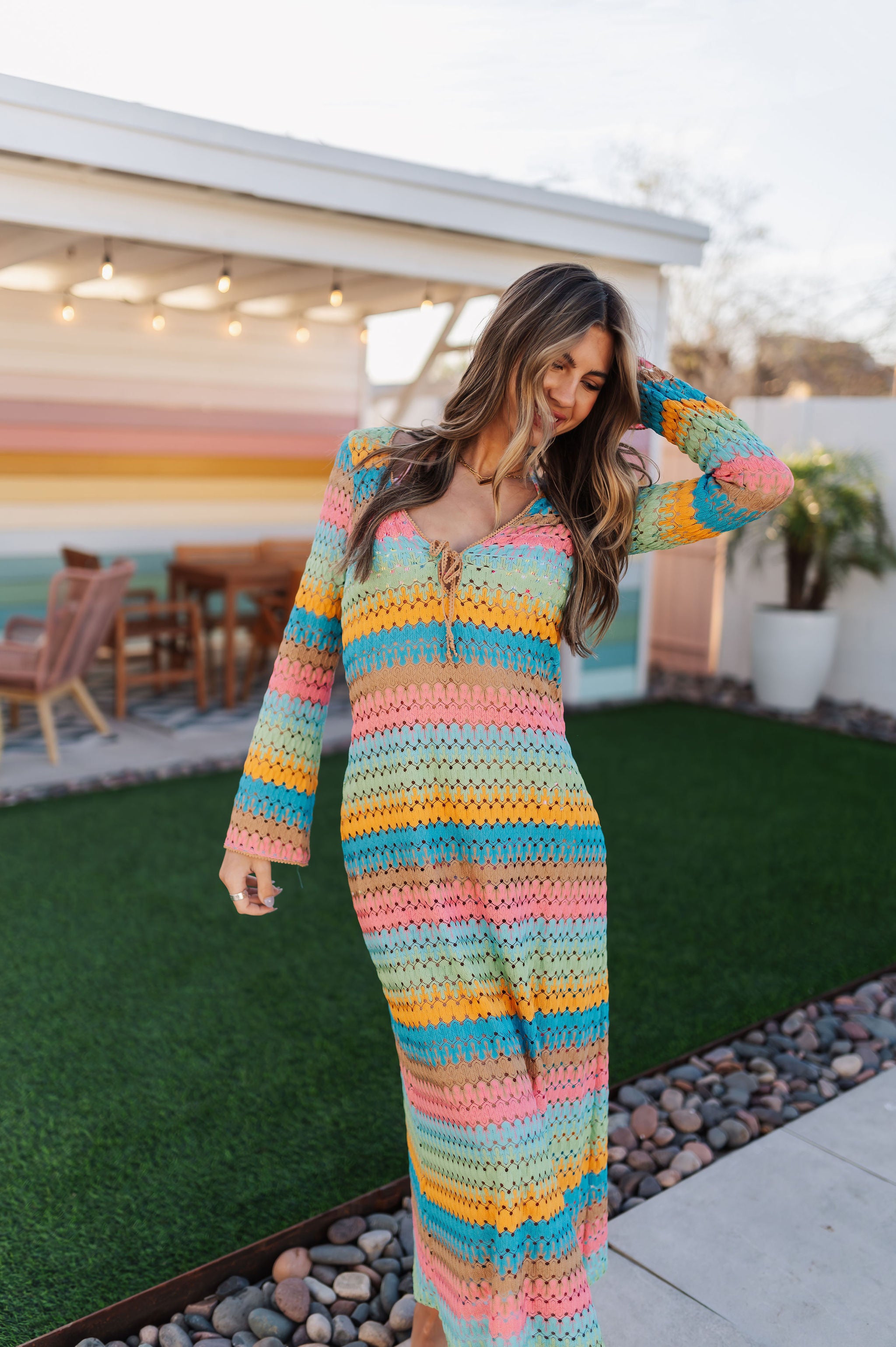 Front view of multi-striped crochet Vacay Coverup with long sleeves and tie front.